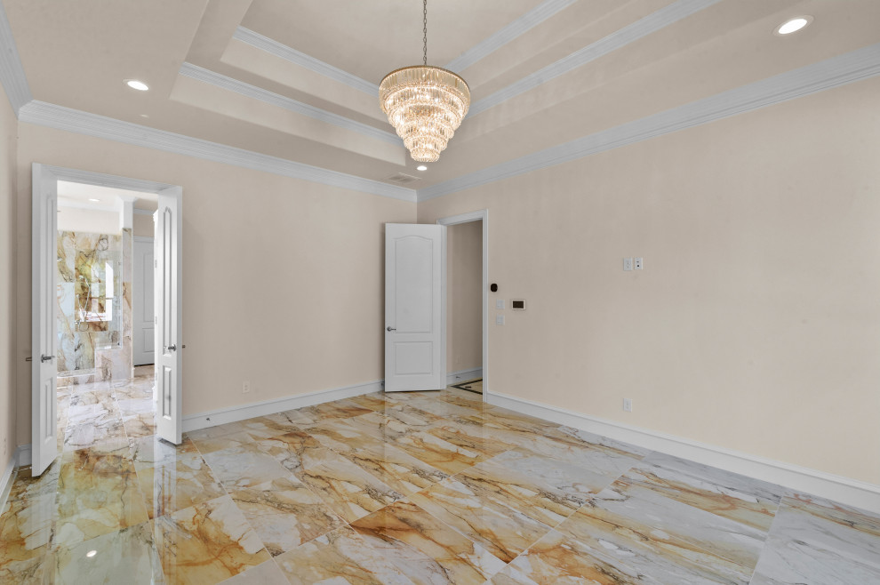 Large mediterranean master bedroom in Dallas with beige walls, marble flooring, beige floors and a drop ceiling.