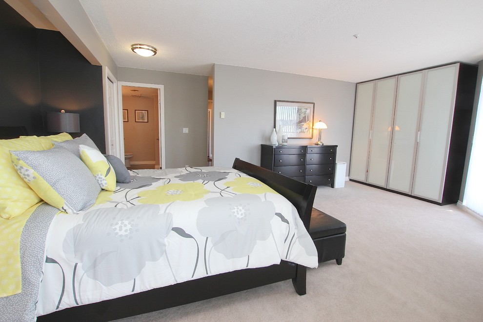 Photo of a contemporary bedroom in Vancouver with carpet.