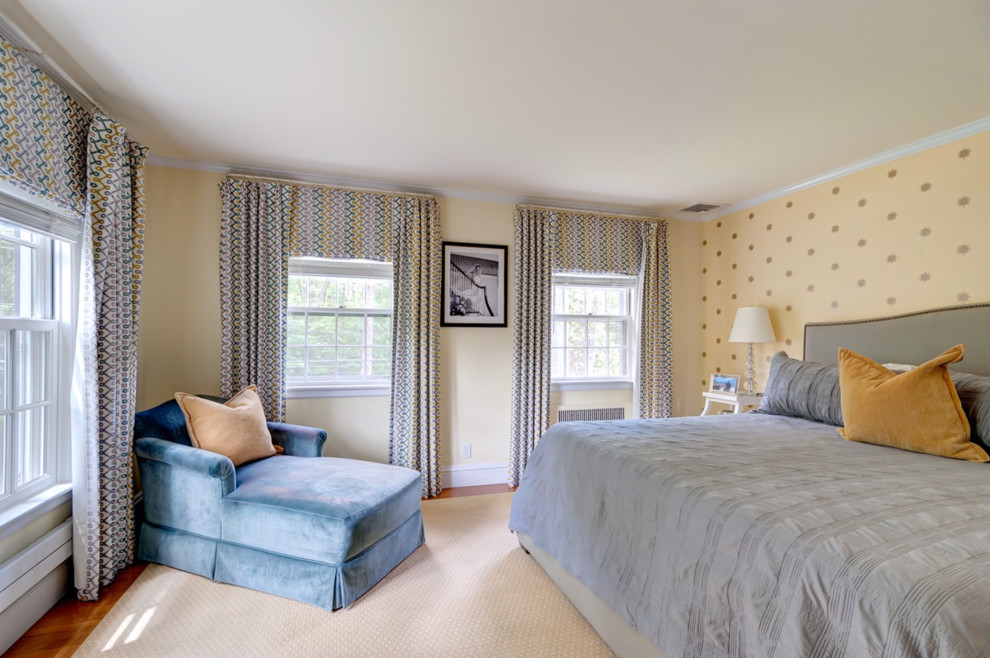 Large elegant guest carpeted and beige floor bedroom photo in Boston with yellow walls