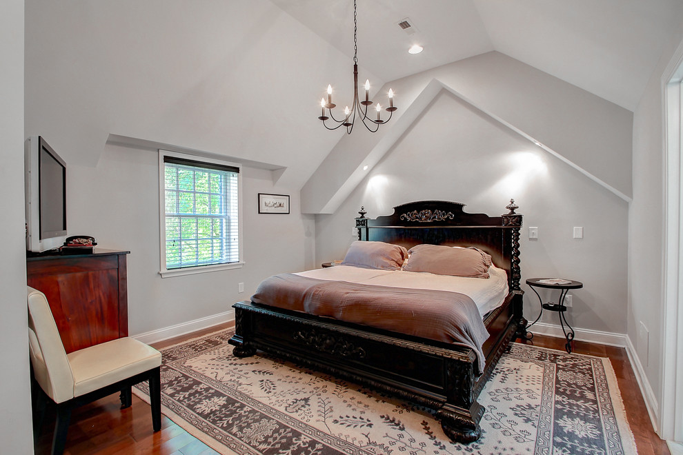 This is an example of a small contemporary master and grey and silver bedroom in Baltimore with grey walls, medium hardwood flooring and no fireplace.