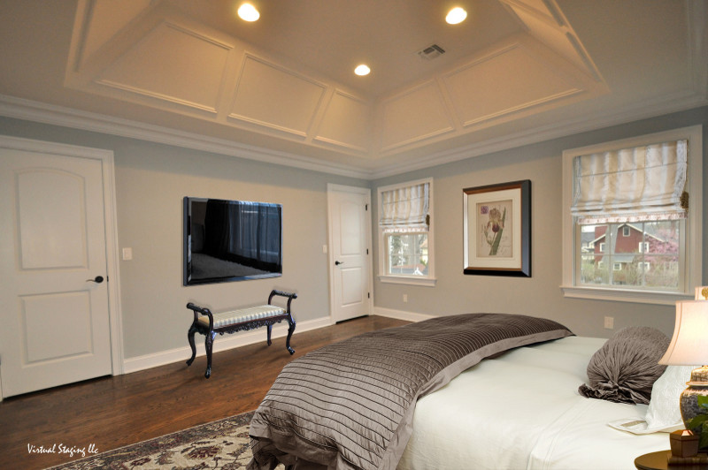 Ejemplo de dormitorio principal minimalista grande con paredes grises y suelo de madera en tonos medios