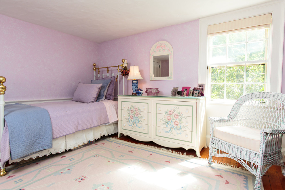 Example of a mid-sized classic guest medium tone wood floor bedroom design in Boston with purple walls