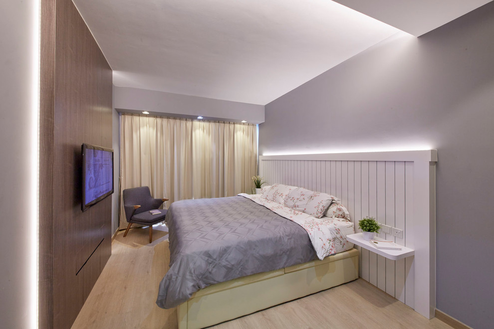Diseño de dormitorio principal nórdico de tamaño medio con paredes grises y suelo de contrachapado