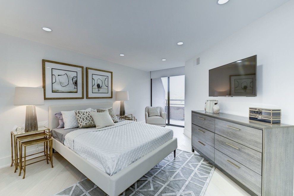 Inspiration for a large contemporary master light wood floor and beige floor bedroom remodel in DC Metro with white walls and no fireplace