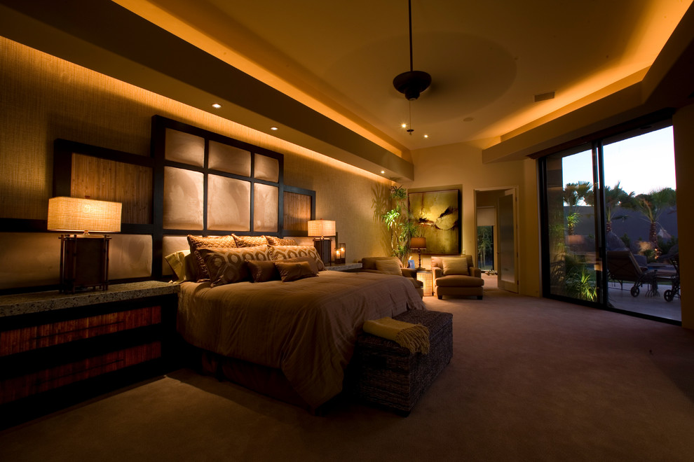 Inspiration for an expansive contemporary master bedroom in Other with beige walls and carpet.