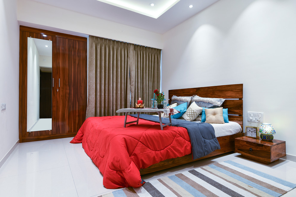 Inspiration for a contemporary bedroom in Bengaluru with white walls, no fireplace and white floors.