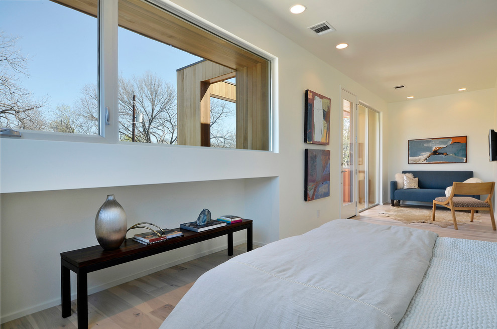 Inspiration for a contemporary bedroom in Austin with white walls.