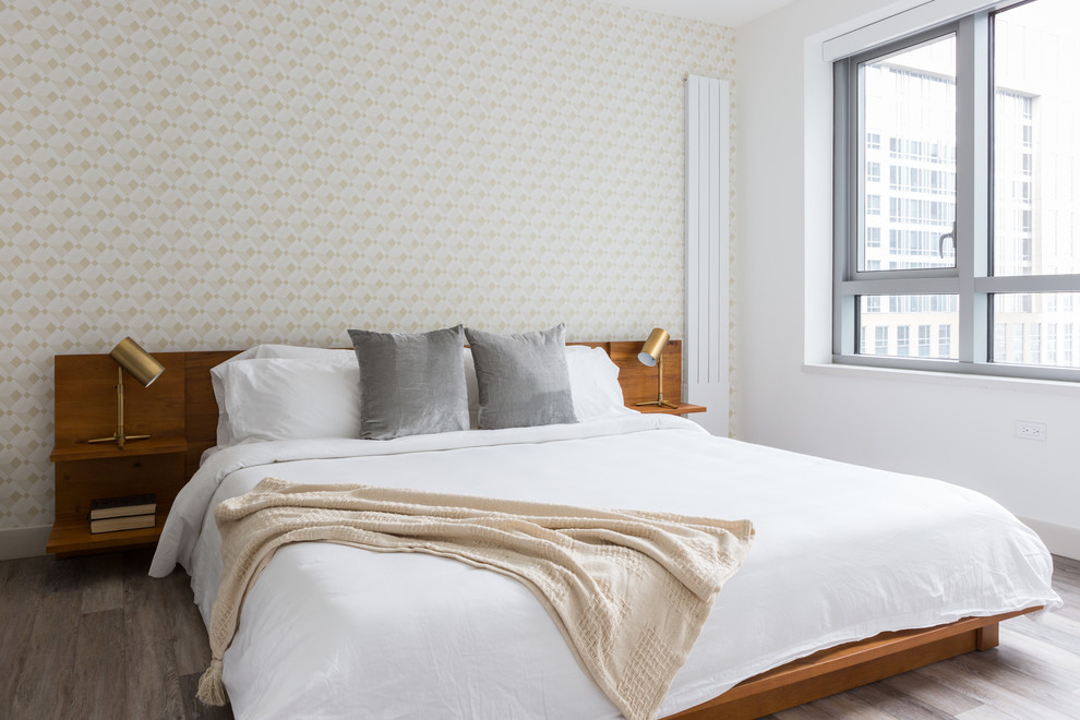Trendy master medium tone wood floor and gray floor bedroom photo in San Francisco with white walls