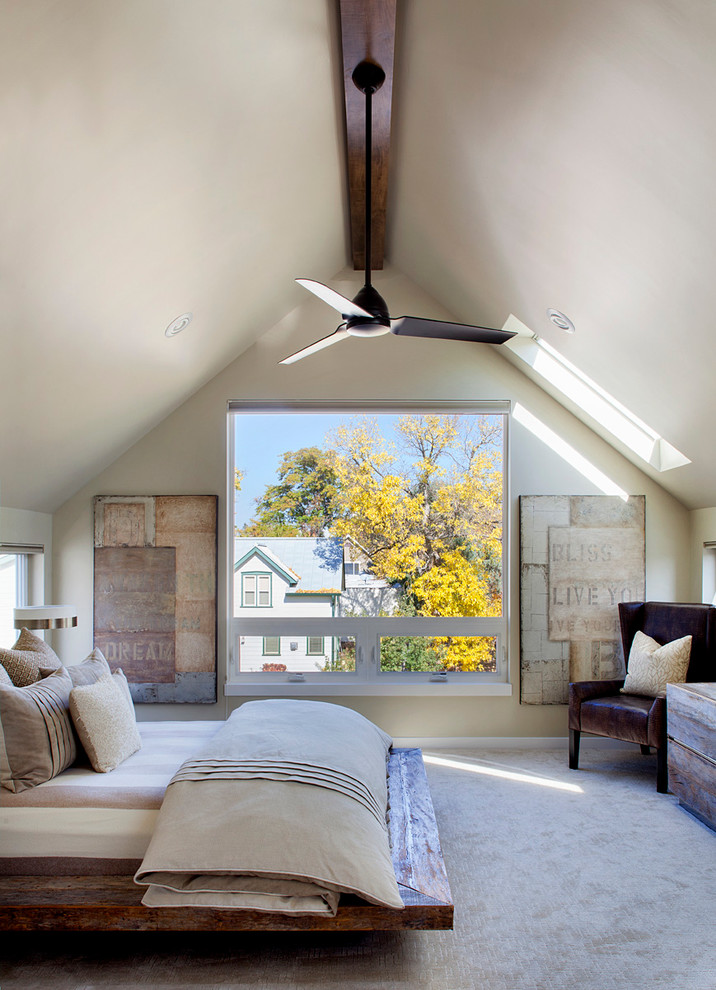 Inspiration for a contemporary master carpeted bedroom remodel in Denver with beige walls