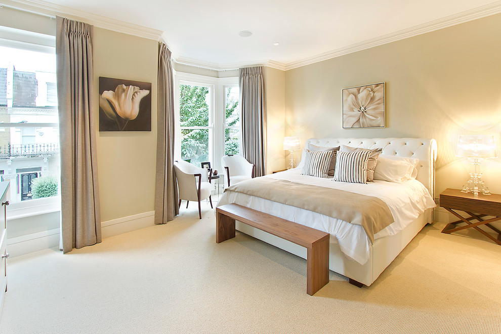 Classic master bedroom in London with feature lighting.