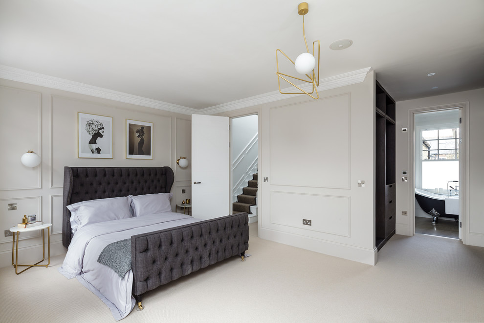 Photo of a medium sized classic grey and cream bedroom in London with grey walls, carpet and beige floors.