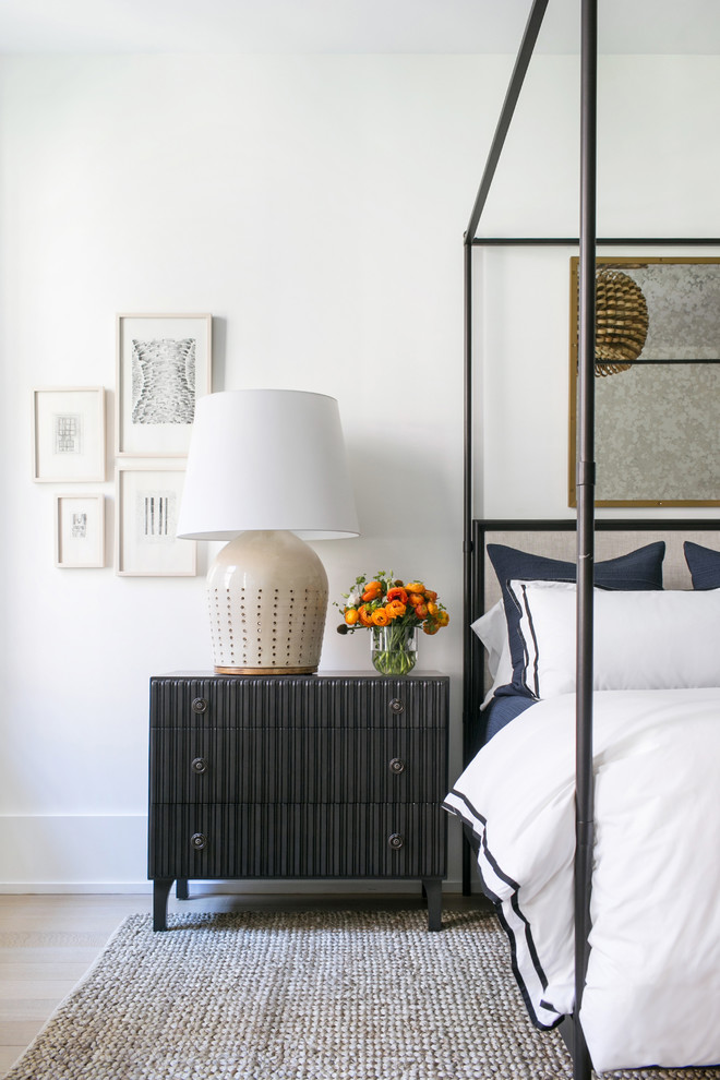 Large transitional master light wood floor and beige floor bedroom photo in New York with white walls and no fireplace