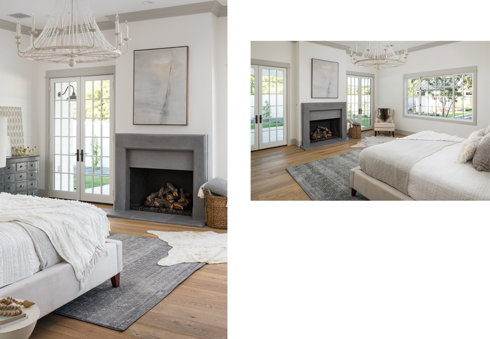 フェニックスにある広いカントリー風のおしゃれな主寝室 (白い壁、淡色無垢フローリング、標準型暖炉、コンクリートの暖炉まわり) のインテリア