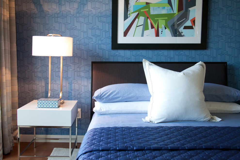 Inspiration for a contemporary bedroom remodel in New York with blue walls