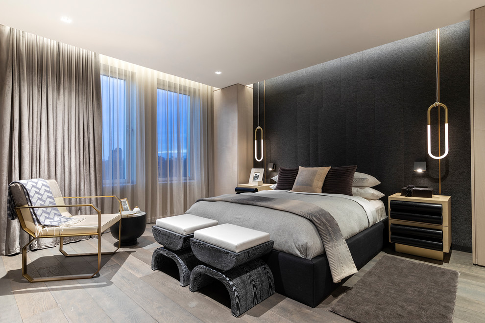 Design ideas for a contemporary master and grey and black bedroom in New York with black walls, no fireplace and medium hardwood flooring.