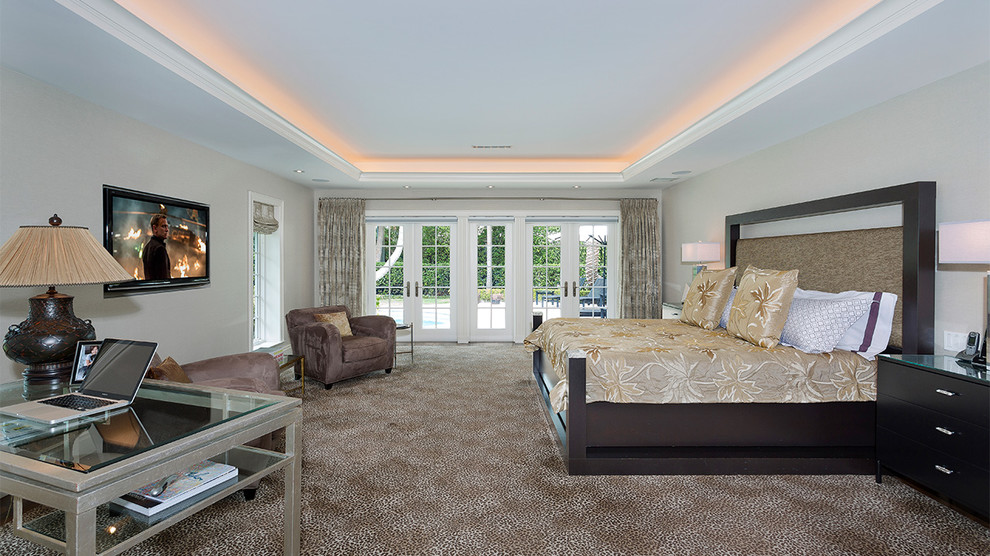 Mid-sized beach style master carpeted and multicolored floor bedroom photo in Other with beige walls and no fireplace