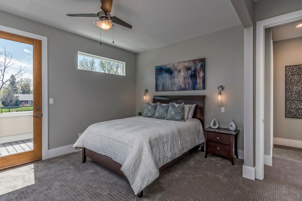 Imagen de dormitorio tipo loft actual de tamaño medio sin chimenea con paredes grises y moqueta