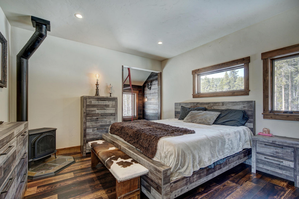 Inspiration for a rustic bedroom in Denver.