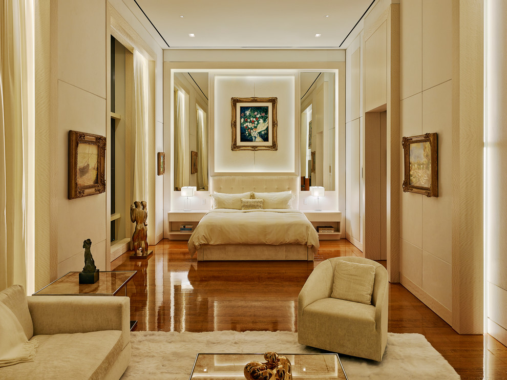 Inspiration for a contemporary bedroom in New York with beige walls and dark hardwood flooring.