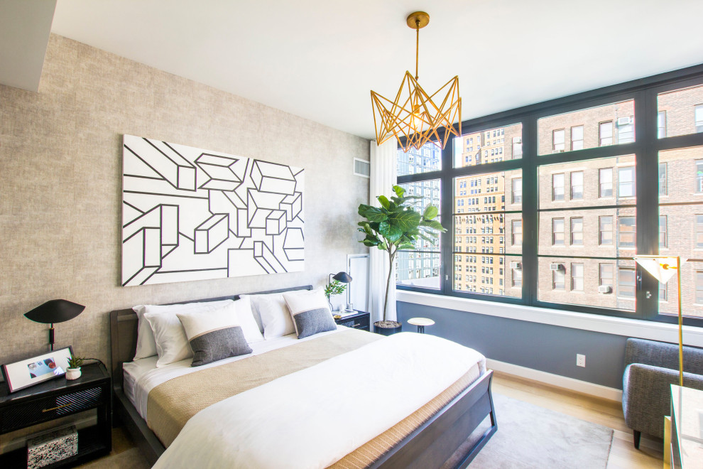 Bedroom - contemporary medium tone wood floor and brown floor bedroom idea in New York with gray walls