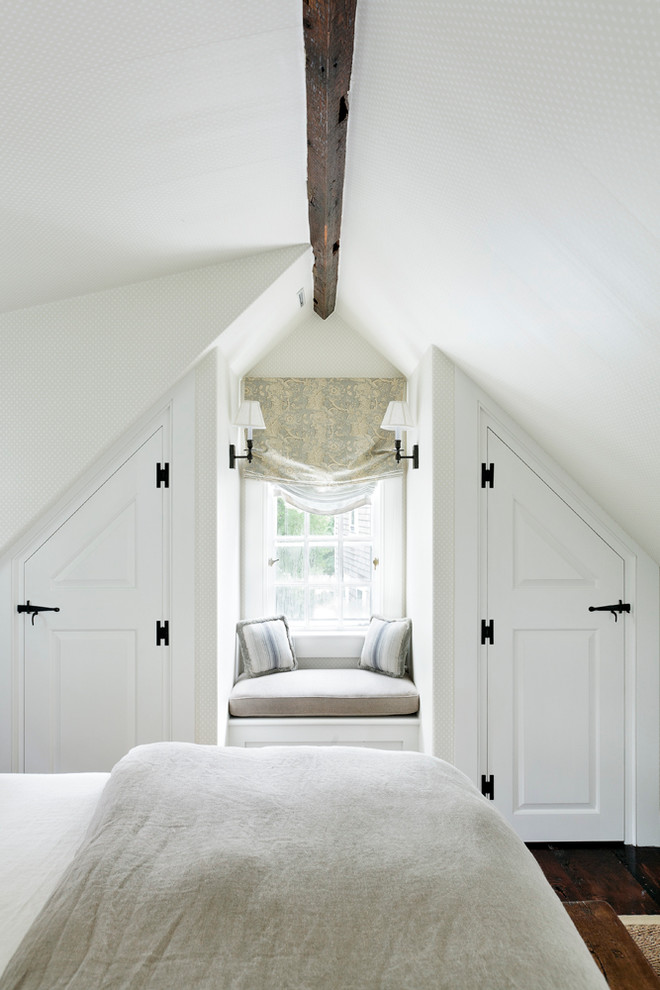 Photo of a coastal bedroom in Boston with white walls and dark hardwood flooring.