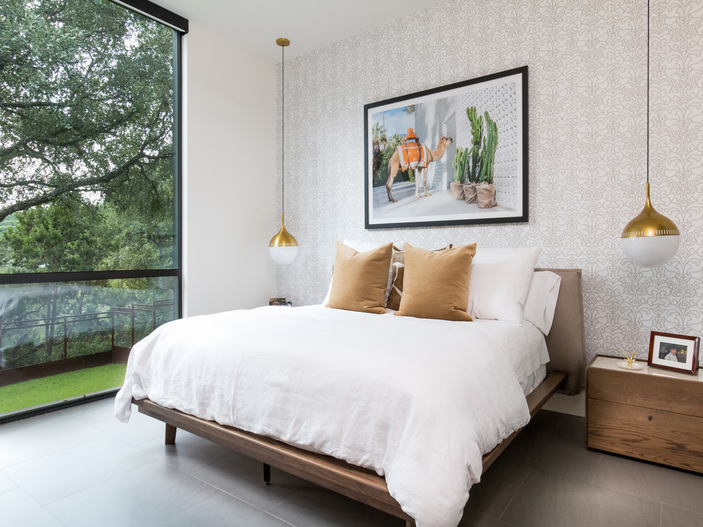 Diseño de dormitorio contemporáneo con paredes blancas y suelo gris