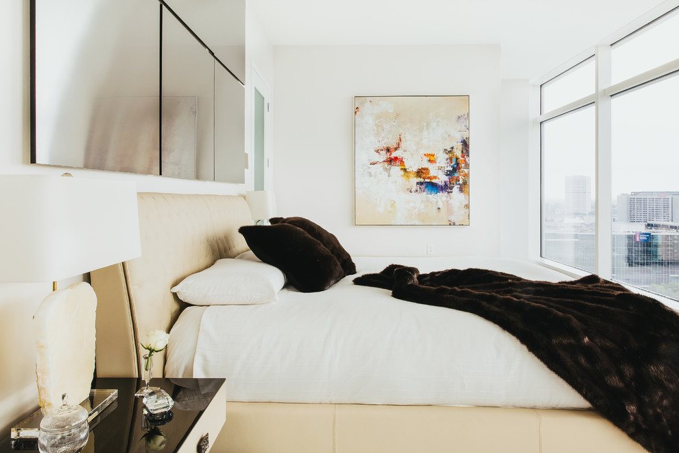 This is an example of a contemporary cream and black bedroom in Atlanta.
