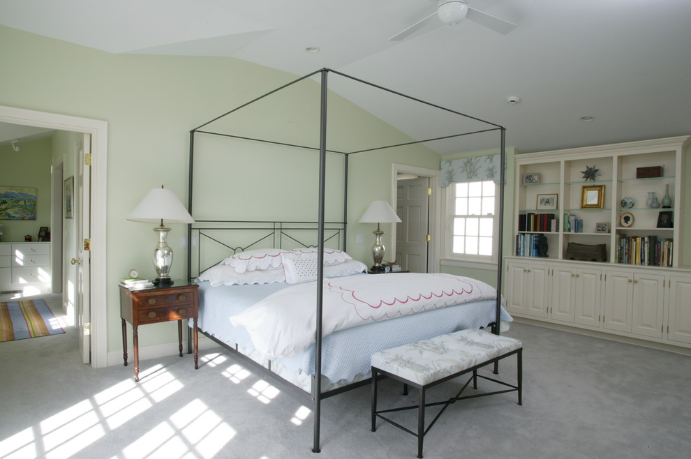 Traditional bedroom in Boston with green walls.