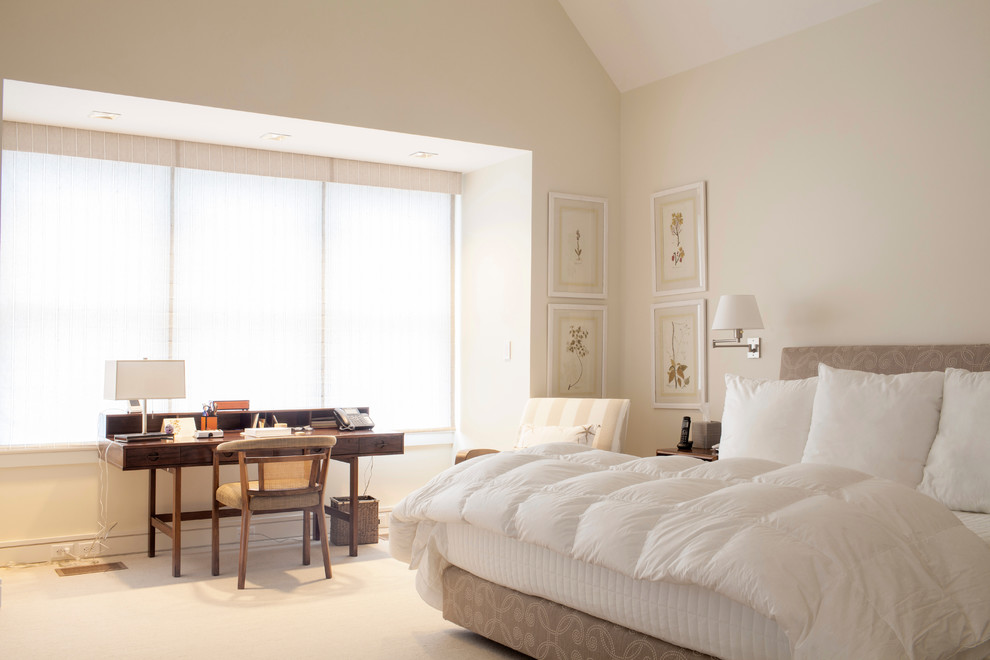 Photo of a traditional bedroom in Boston with beige walls.