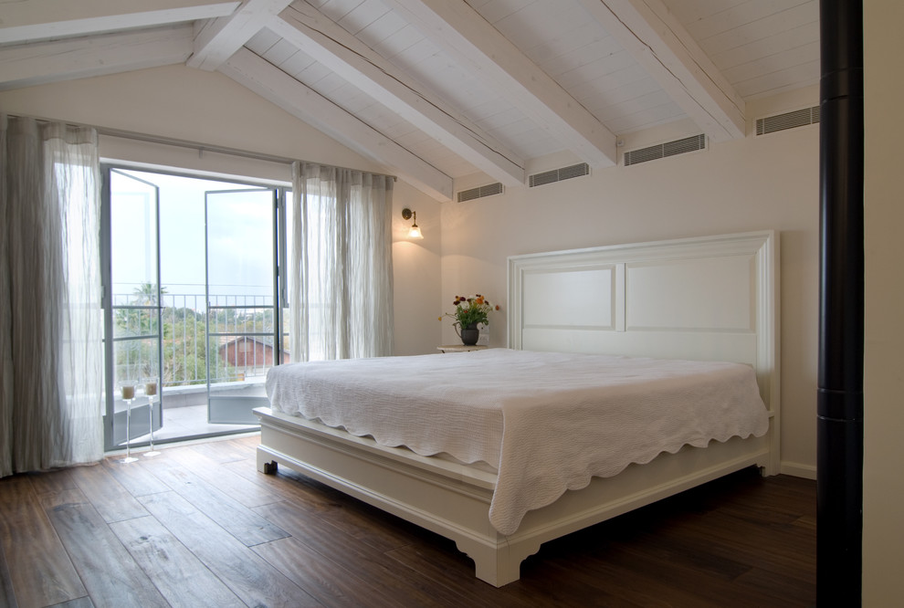 Bedroom - contemporary dark wood floor bedroom idea in Tel Aviv with beige walls