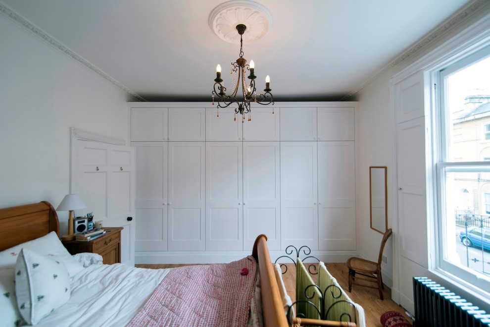 Inspiration for a medium sized traditional master bedroom in Wiltshire with white walls and medium hardwood flooring.