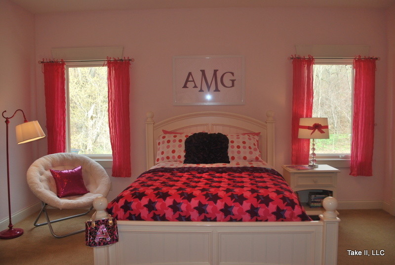 Example of a mid-sized transitional carpeted bedroom design in Other with pink walls