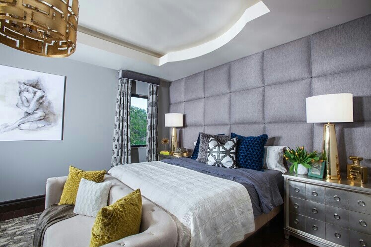 Photo of a large contemporary master bedroom in Miami with grey walls and medium hardwood flooring.