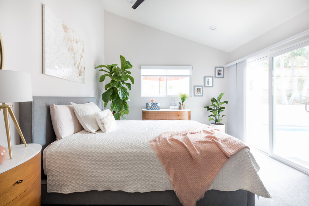 Traditional grey and pink bedroom in San Diego with grey walls, carpet and grey floors.