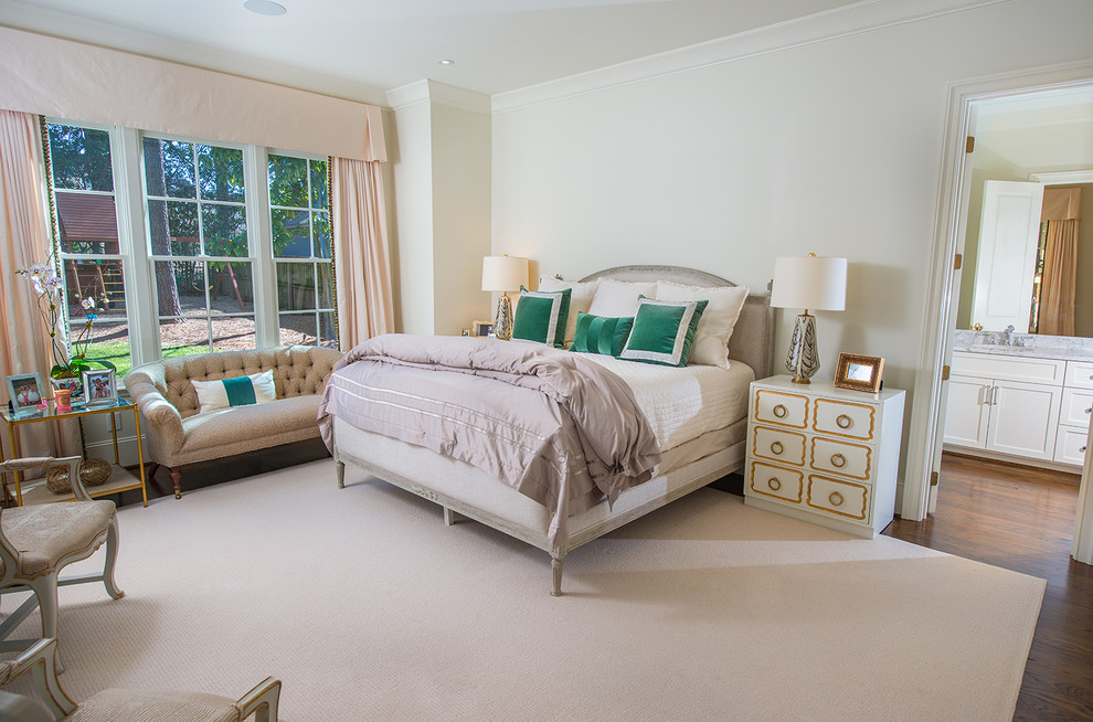 Traditional master and grey and pink bedroom in Raleigh with white walls, dark hardwood flooring and brown floors.