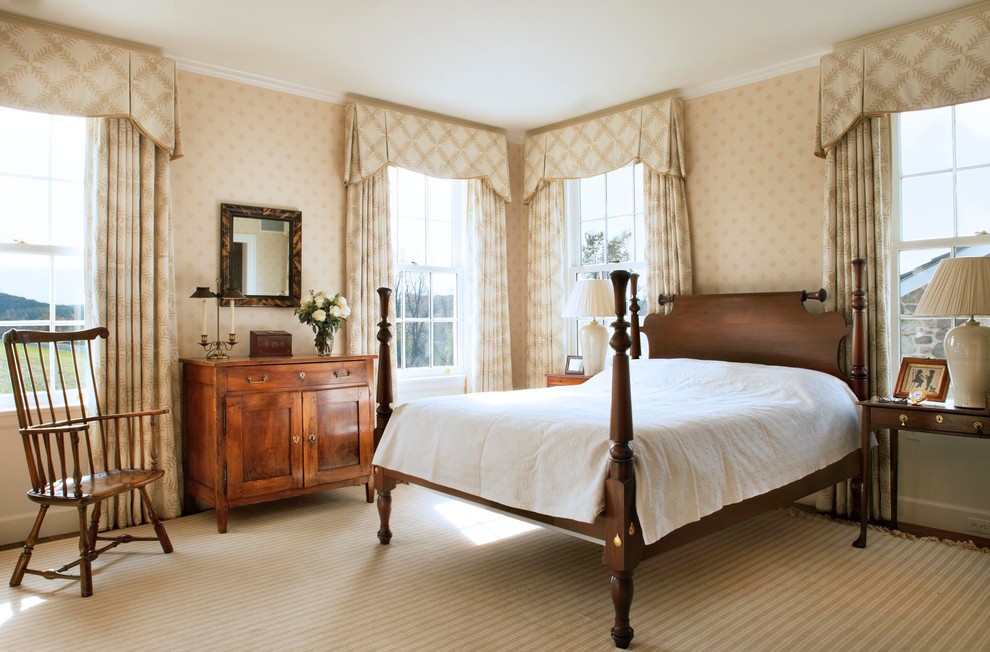 Inspiration for a country bedroom in New York with beige walls.