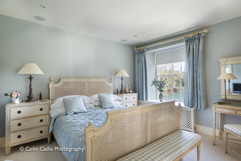 Design ideas for a medium sized nautical master bedroom in Devon with blue walls and carpet.
