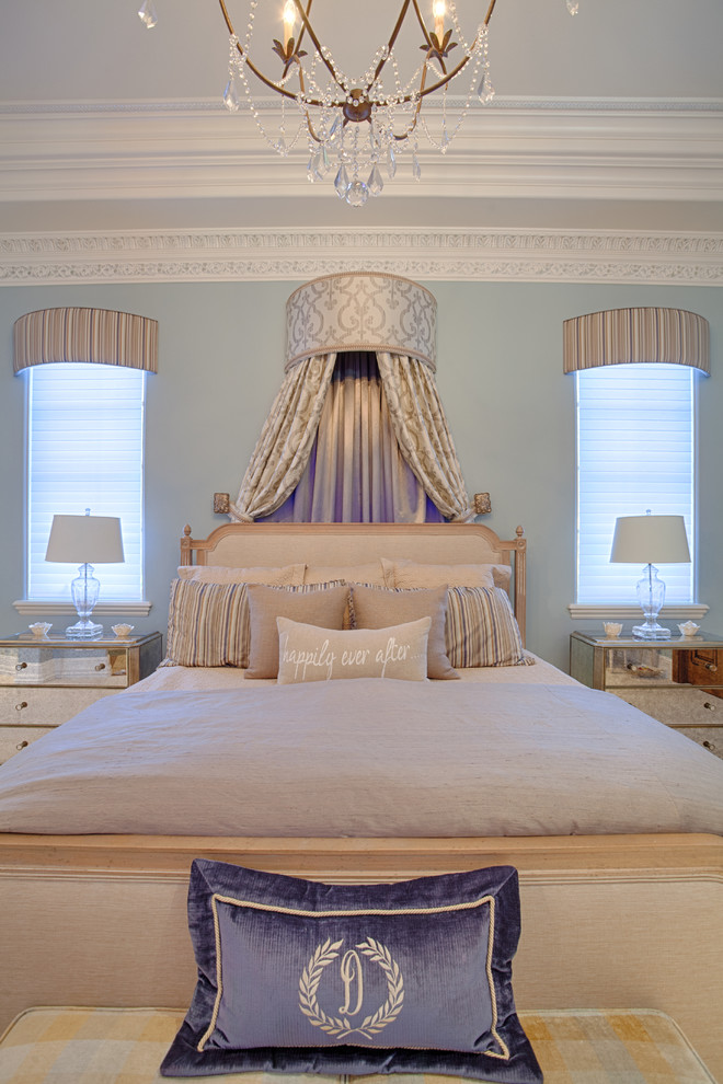 Inspiration for a large transitional master bedroom remodel in Orlando with blue walls