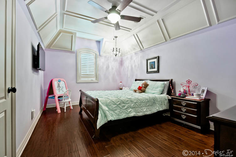 Design ideas for a classic guest bedroom in Little Rock with purple walls, dark hardwood flooring and no fireplace.