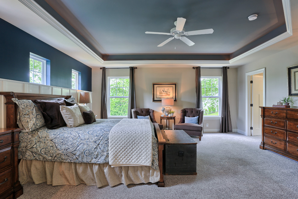 Example of a large country master carpeted bedroom design in Philadelphia with blue walls
