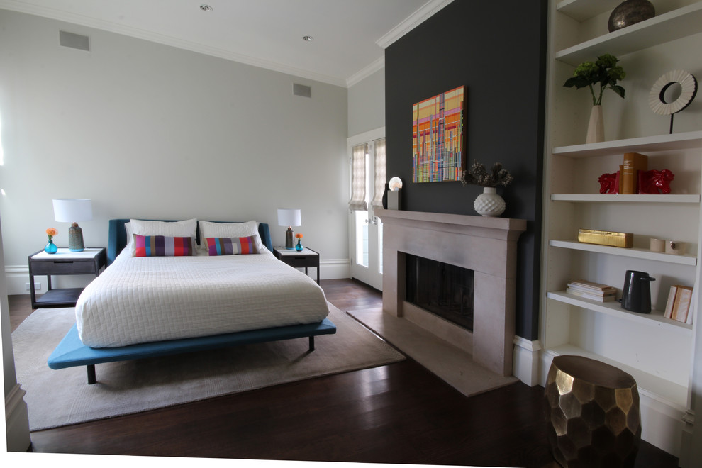 Mid-sized minimalist master dark wood floor bedroom photo in San Francisco with white walls, a standard fireplace and a stone fireplace