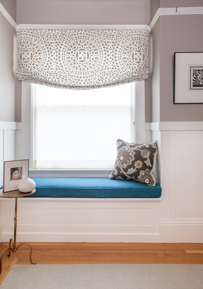 Bedroom - small eclectic guest medium tone wood floor bedroom idea in San Francisco with beige walls