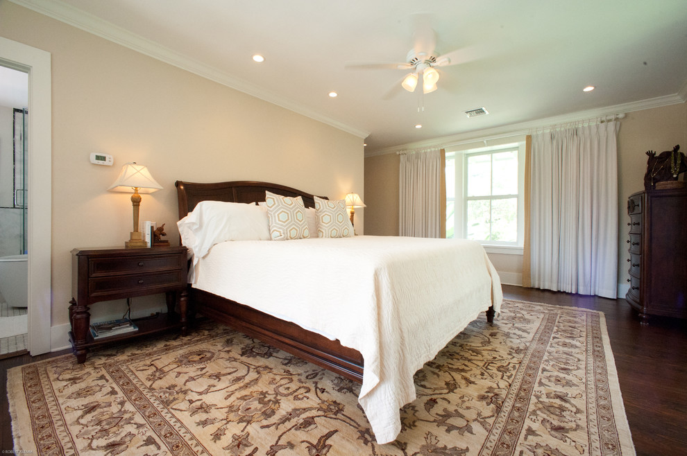 Inspiration for a mid-sized tropical laminate floor bedroom remodel in Miami with white walls