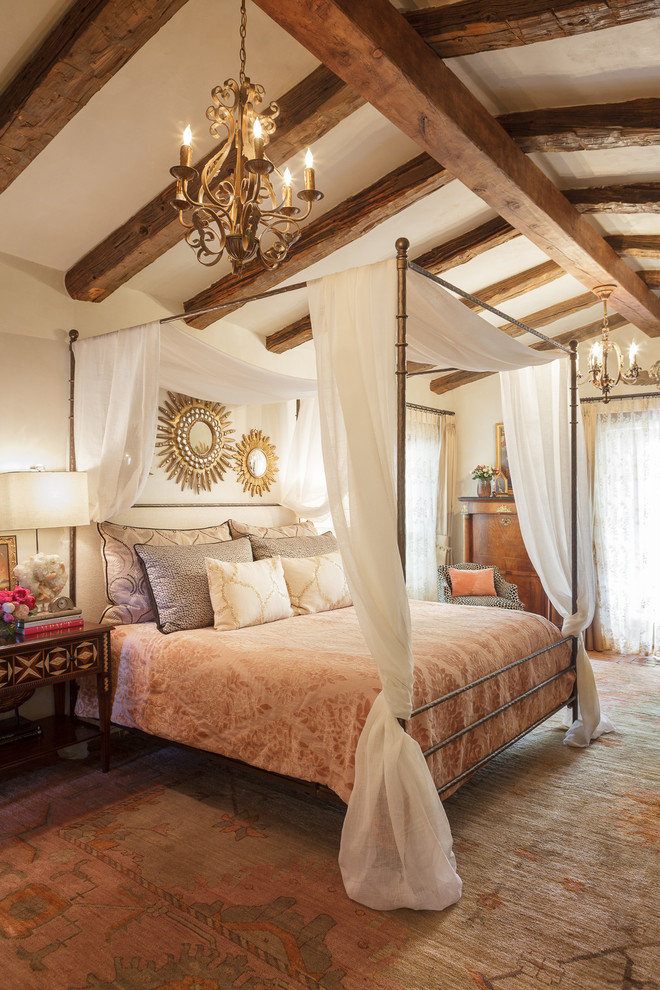 Mid-sized southwest master carpeted bedroom photo in Albuquerque with white walls, a standard fireplace and a plaster fireplace