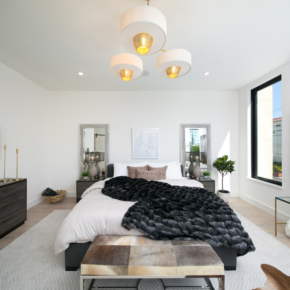 Inspiration for a contemporary bedroom in San Francisco with white walls and light hardwood flooring.