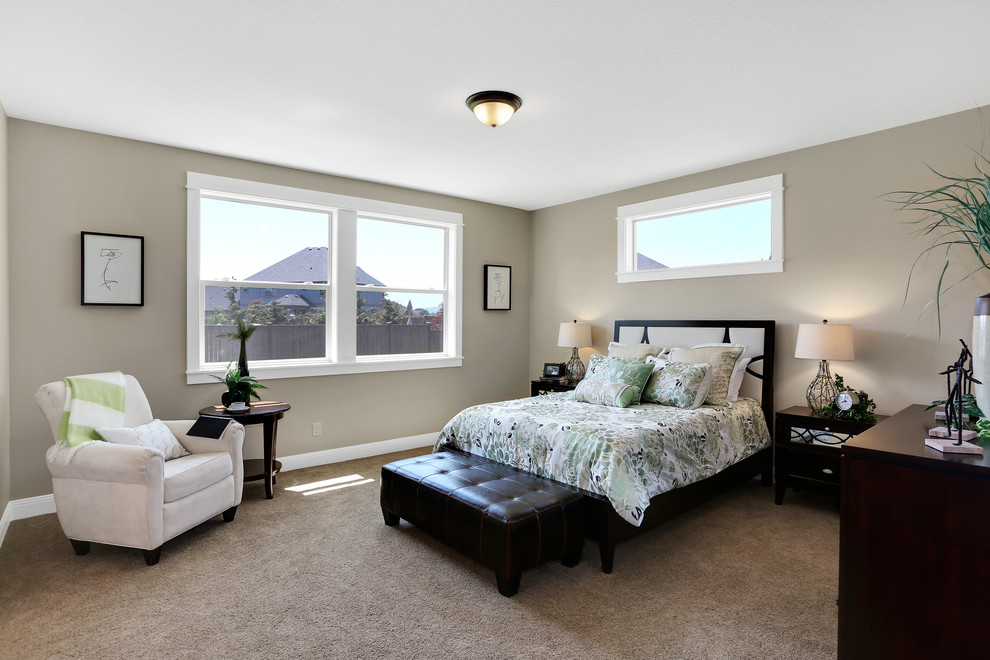 Large elegant loft-style carpeted bedroom photo in Portland with beige walls and no fireplace