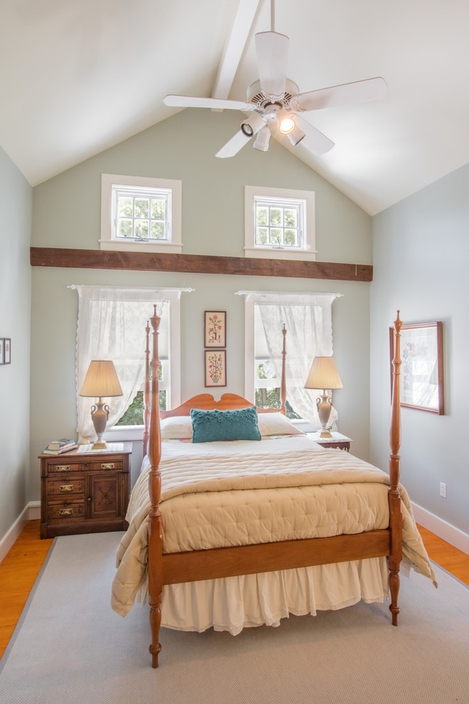 Mid-sized cottage guest light wood floor bedroom photo in Burlington with green walls