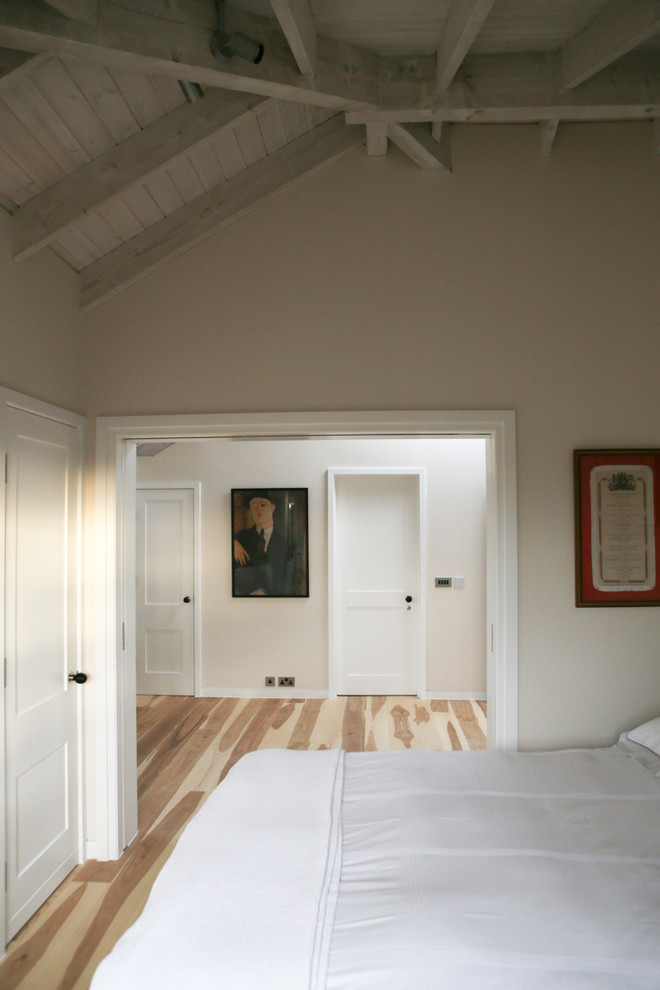 Design ideas for a medium sized scandi bedroom in London.