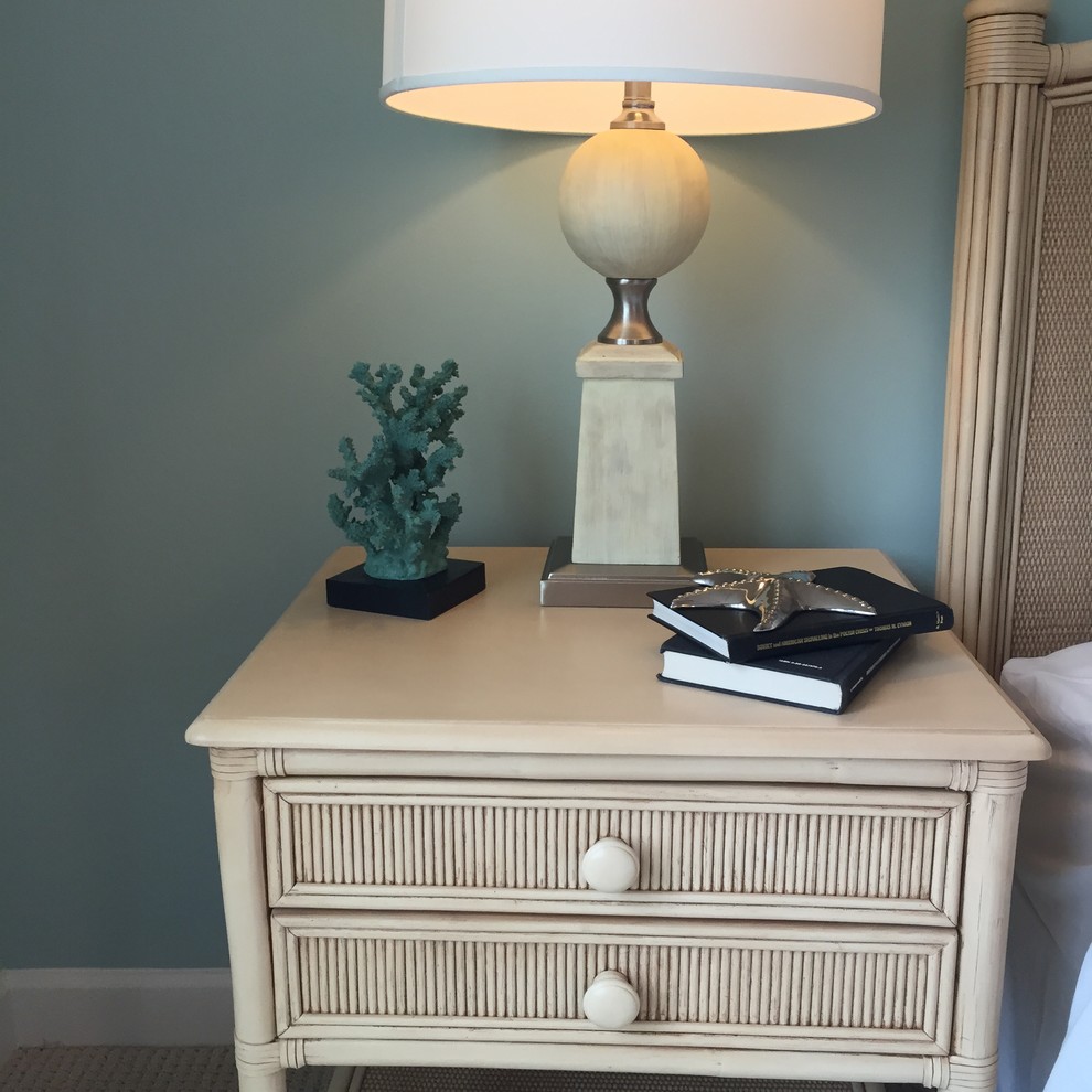 Inspiration for a beach style guest bedroom in Other with blue walls and carpet.