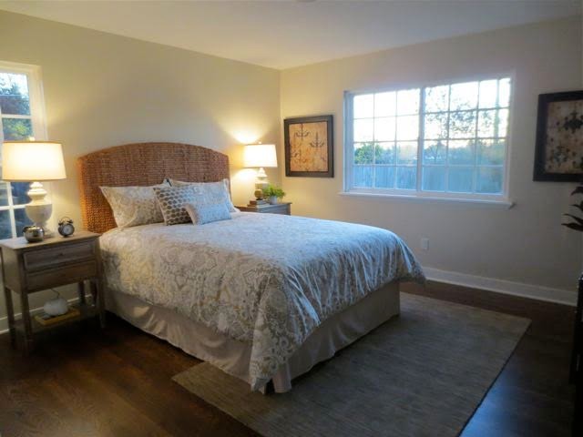 Inspiration for a medium sized traditional master bedroom in Sacramento with beige walls, dark hardwood flooring, no fireplace and brown floors.